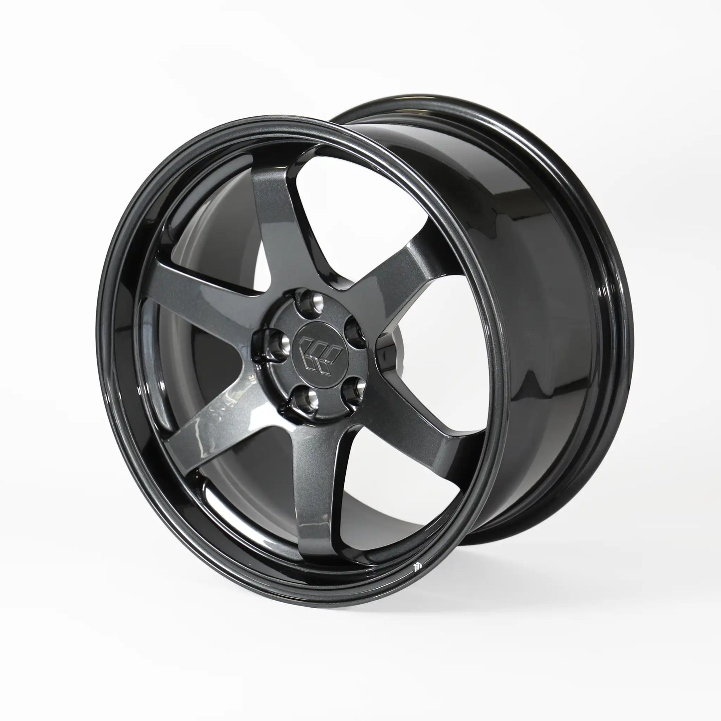 A glossy black multi-spoke alloy wheel rim, photographed at a three-quarter angle on a clean white studio background.