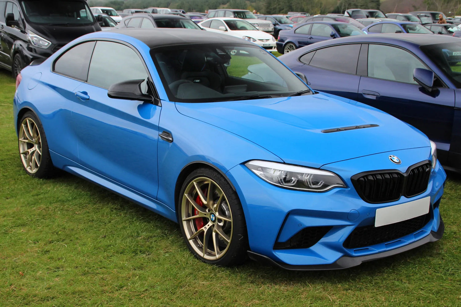 BMW F87 M2 CS in Misano Blue Metallic with gold performance wheels