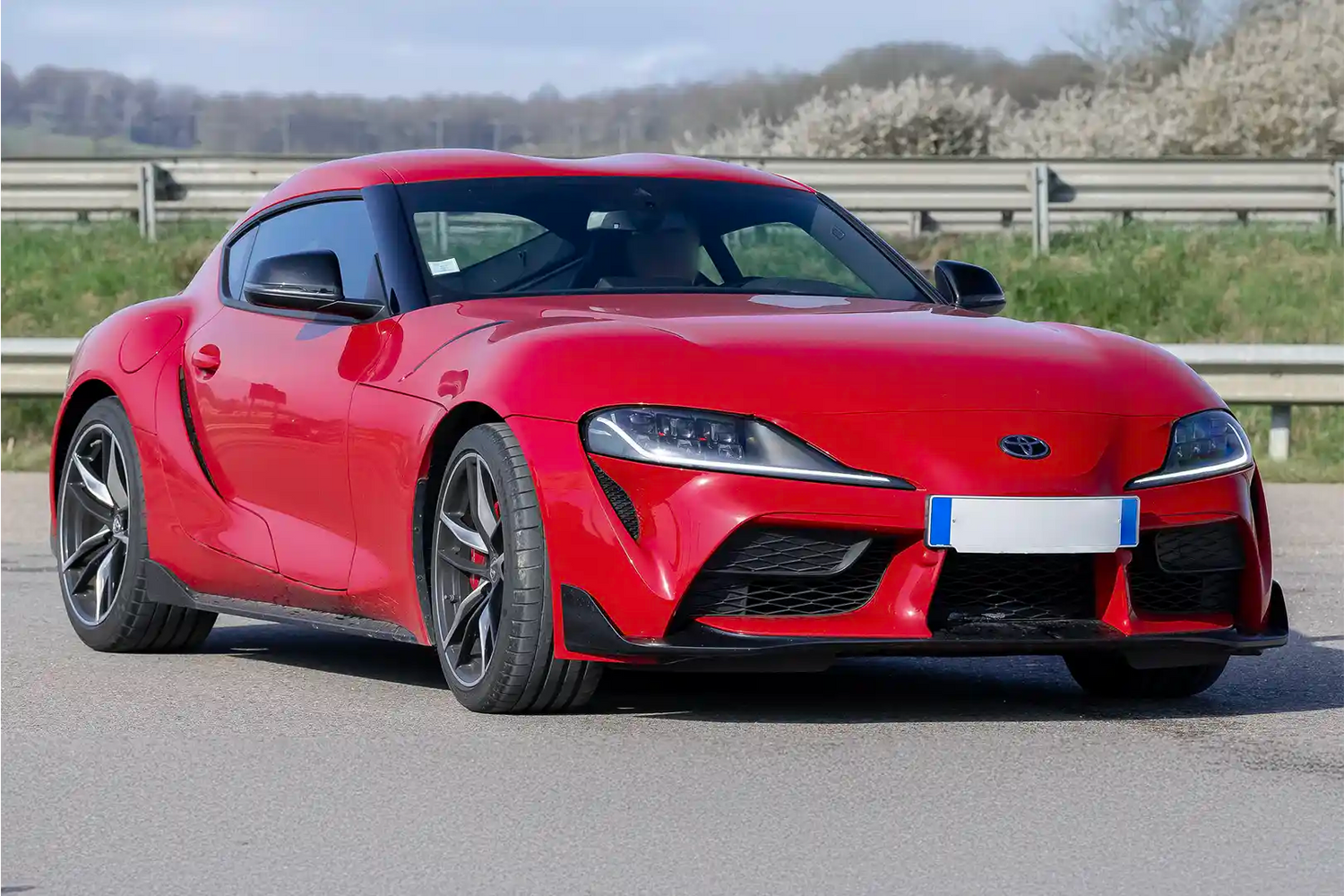 Toyota GR Supra A90 sports coupe in Renaissance Red