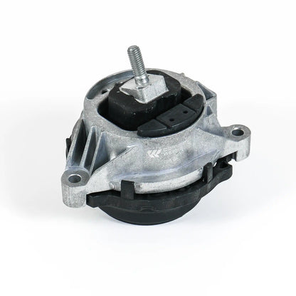 An automotive engine mount with a silver cast aluminum housing, black rubber bushings, and a threaded bolt assembly, photographed on a white background.