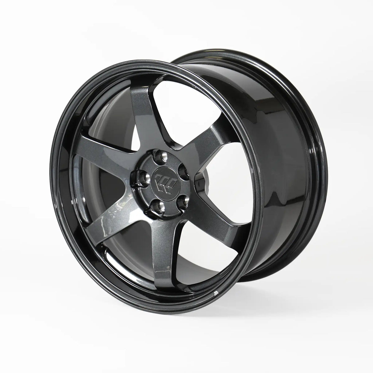 A glossy black multi-spoke alloy wheel rim, photographed at a three-quarter angle on a clean white studio background.