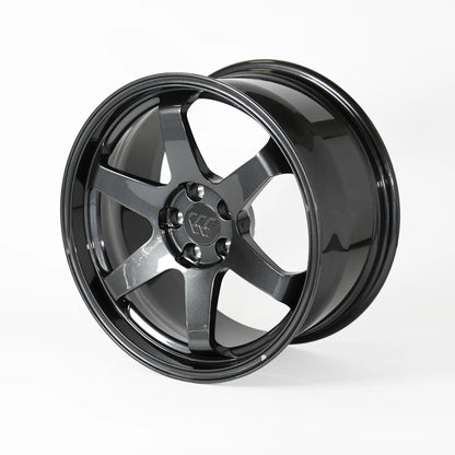 A glossy black multi-spoke alloy wheel rim, photographed at a three-quarter angle on a clean white studio background.