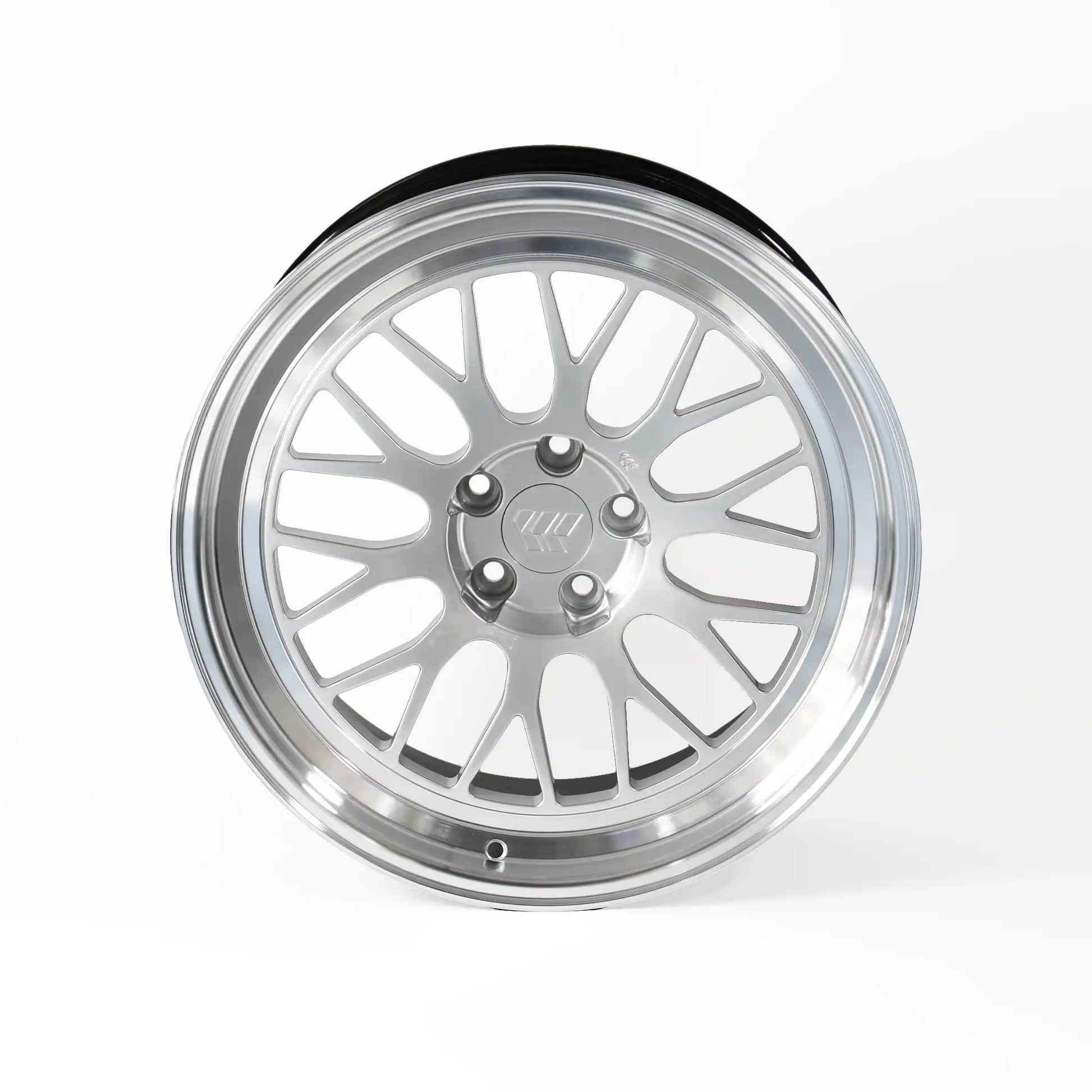 A polished silver multi-spoke alloy wheel rim with a black outer tire bead, shown from a three-quarters perspective on a light gray background.