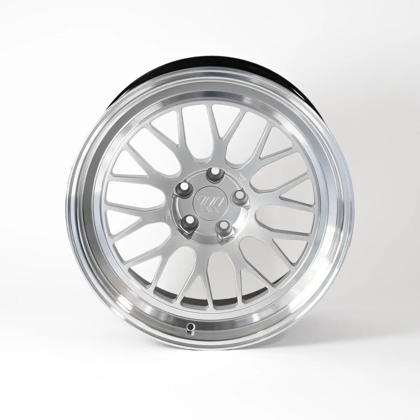 A polished silver multi-spoke alloy wheel rim with a black outer tire bead, shown from a front-three-quarter angle on a light gray background.